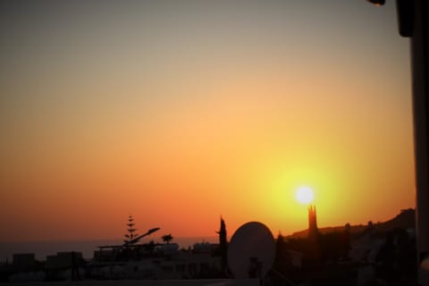 Sun setting as can be viewed from the apartment terraces or bathroom window.