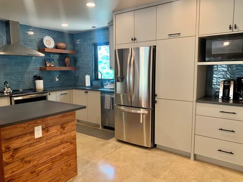 Large fridge, microwave and coffee makers