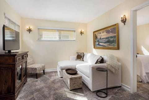 The  living space offers a HD TV and cozy couch for lounging.