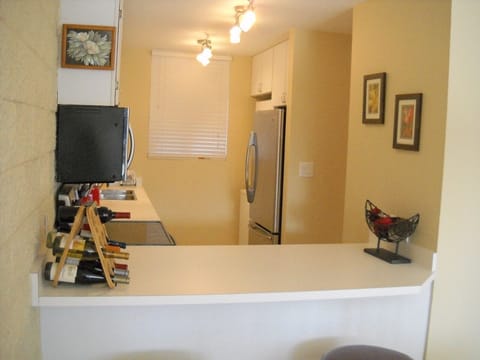 Next to the new fridge is a washer/dryer