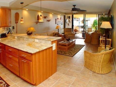 Kitchen has been totally remodeled-Living area opens up to the extra large lanai