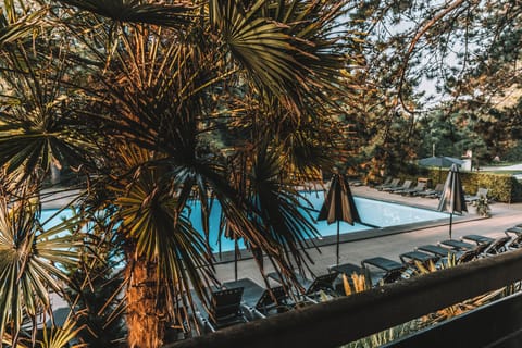 Seasonal outdoor pool, open 9:00 AM to 9:00 PM, pool umbrellas