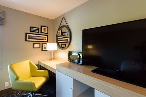 Desk, laptop workspace, iron/ironing board, free cribs/infant beds