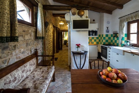 Casa Artuico's dining/sitting/kitchen area with view to corridor and bedroom
