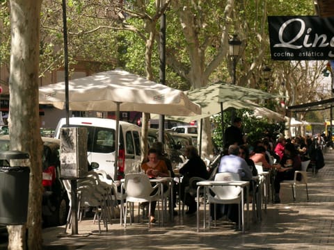 Civilised cafe society Bars, restaurants encircling art deco Mercado Abastos. 