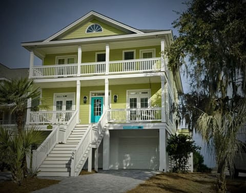 Luxury, well-furnished, ADA-compliant 5-bedroom, 4-bath marshfront home with elevator access, comfortably sleeping up to 15 guests.