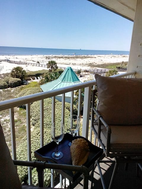 Comfortable chairs and table on balcony- a lovely place to enjoy the views