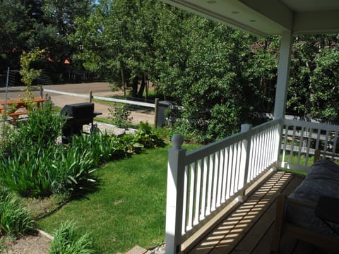 front porch with couch for kicking back and looking at the mountains or a BBQ