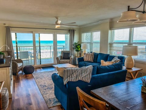 An abundance of windows showcasing the beach and ocean, just 25 feet away