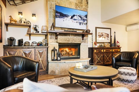 Enjoy the new convenient custom-built Coffee Bar and OLED 65” TV