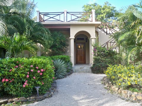 Lush landscaping delights the senses as you enter your vacation home!