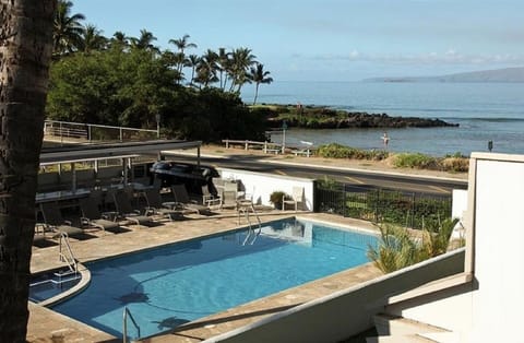 View of pool and ocean from rear lanai