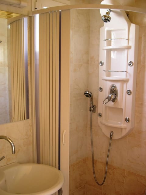 Shower, free toiletries, hair dryer, slippers