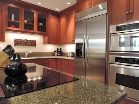 African Mahogany Cabinetry accented with beautiful granite countertops.