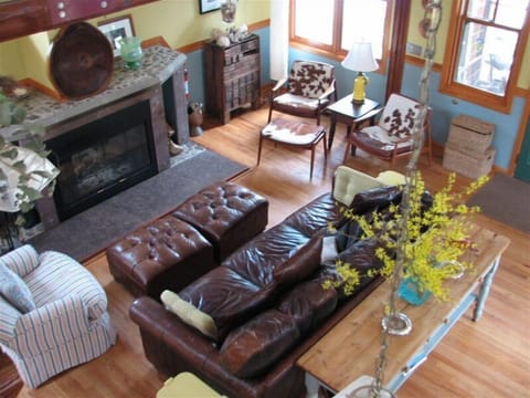 View of Great room from the loft.  Fireplace  and oversized leather couch.
