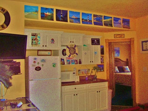 Kitchenette and 2 bedrooms on walk in level off pool, grill, and volleyball.