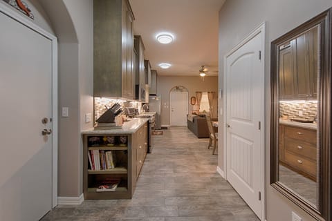 Back door leads to outdoor shower & private patio