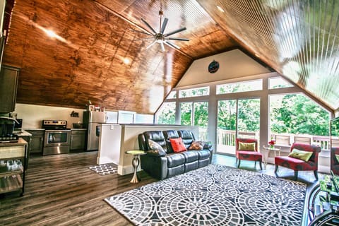 Wall of windows with double sliding door access to deck