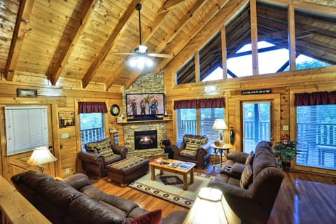 Large open concept living room with 60" tv.