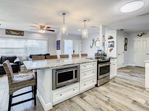 View of large eating are with seating for 6. All appliances are fairly new.