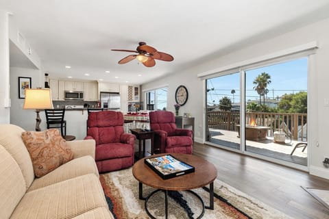 Open floor plan with 8 ft. Sliders to large deck