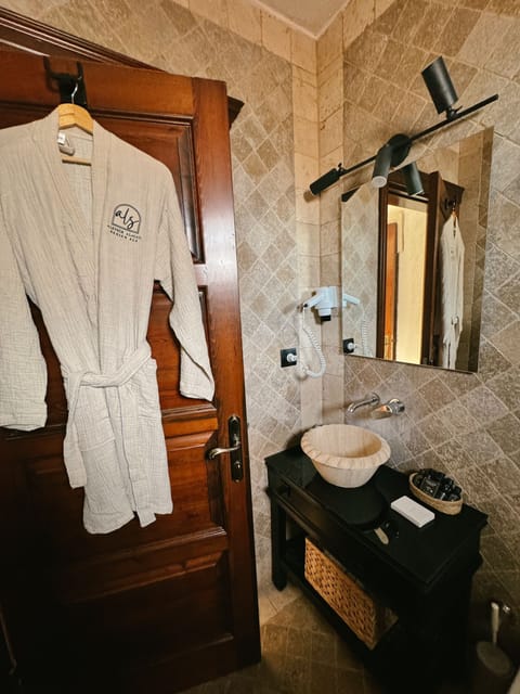 Shower, rainfall showerhead, designer toiletries, hair dryer