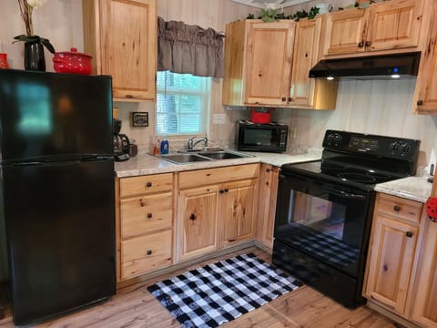 Full kitchen with microwave; hand and dish washing soap provided.