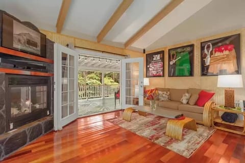 Spacious living room with french doors that open to the lanai