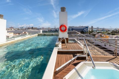 Outdoor pool, open 10:00 AM to 8:00 PM, pool umbrellas, sun loungers