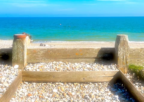 Step onto the beach from the Beach House