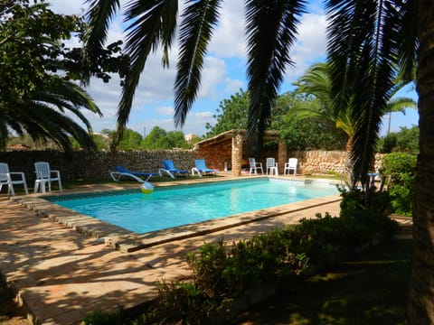 Private pool with lots of seating and shade.