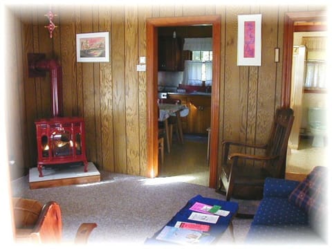 Cozy main room with a Ben Franklin style gas heat stove in case of a chilly nite