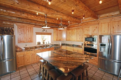 Fully stocked kitchen with all the cooking supplies and appliances needed.