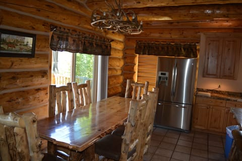Custom 8 ft log dining table, chairs, benches & bar stools.