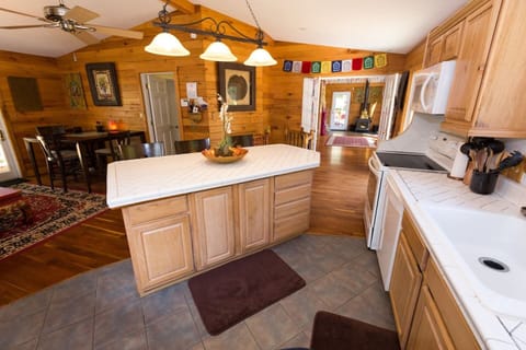 Fully stocked kitchen with all the essentials - 2 refrigerators, an oven, stove, cutlery, cookware, and utensils!