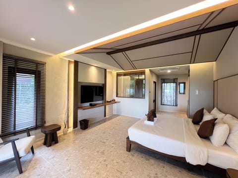 Villa, 1 King Bed, Beachfront | Minibar, in-room safe, desk, laptop workspace