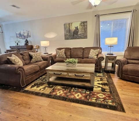 couch, loveseat and recliner in the living room