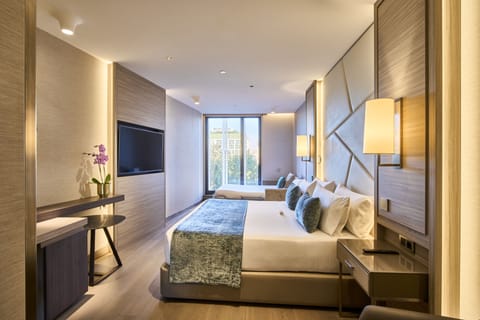 Premium bedding, down comforters, pillowtop beds, minibar