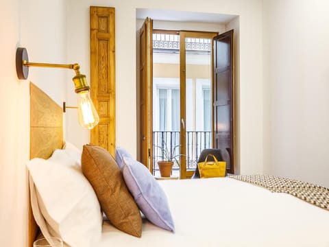 Premium bedding, desk, laptop workspace, blackout drapes
