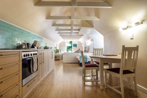 Loft Apartment | Premium bedding, desk, iron/ironing board, free cribs/infant beds