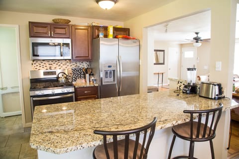 Kitchen with brand new appliances and cabinets,  Granite counter tops, Island

