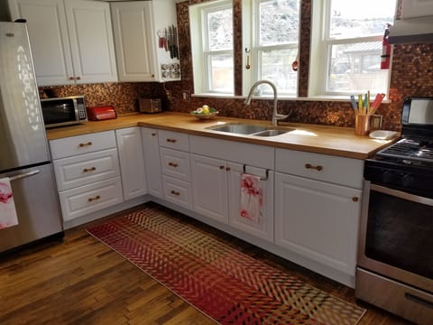 A full kitchen with stainless appliances and everything you could possibly need.