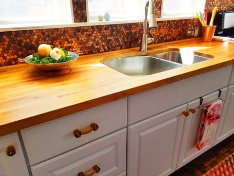 The Copper Penny back splash and butcher block count tops.