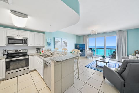 Wake up to breathtaking ocean views from your bright, beachfront retreat with a fully equipped kitchen and cozy living space.