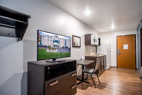 Desk, laptop workspace, blackout drapes, iron/ironing board