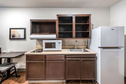 Desk, laptop workspace, blackout drapes, iron/ironing board