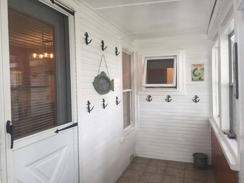 entry in screened in porch to hang your gear and towels
