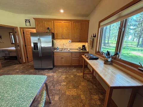Large refrigerator with ice and water in door.  Coffee maker and Toaster.