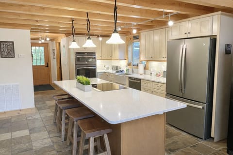 Enjoy cooking in fully equipped kitchen with large island eat-in bar!