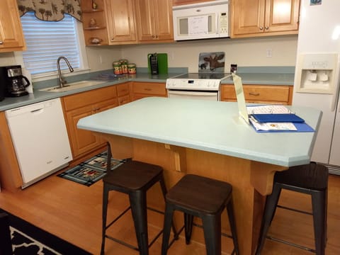 Kitchen /open floor plan to living and dining room. Perfect island /4 bar stools